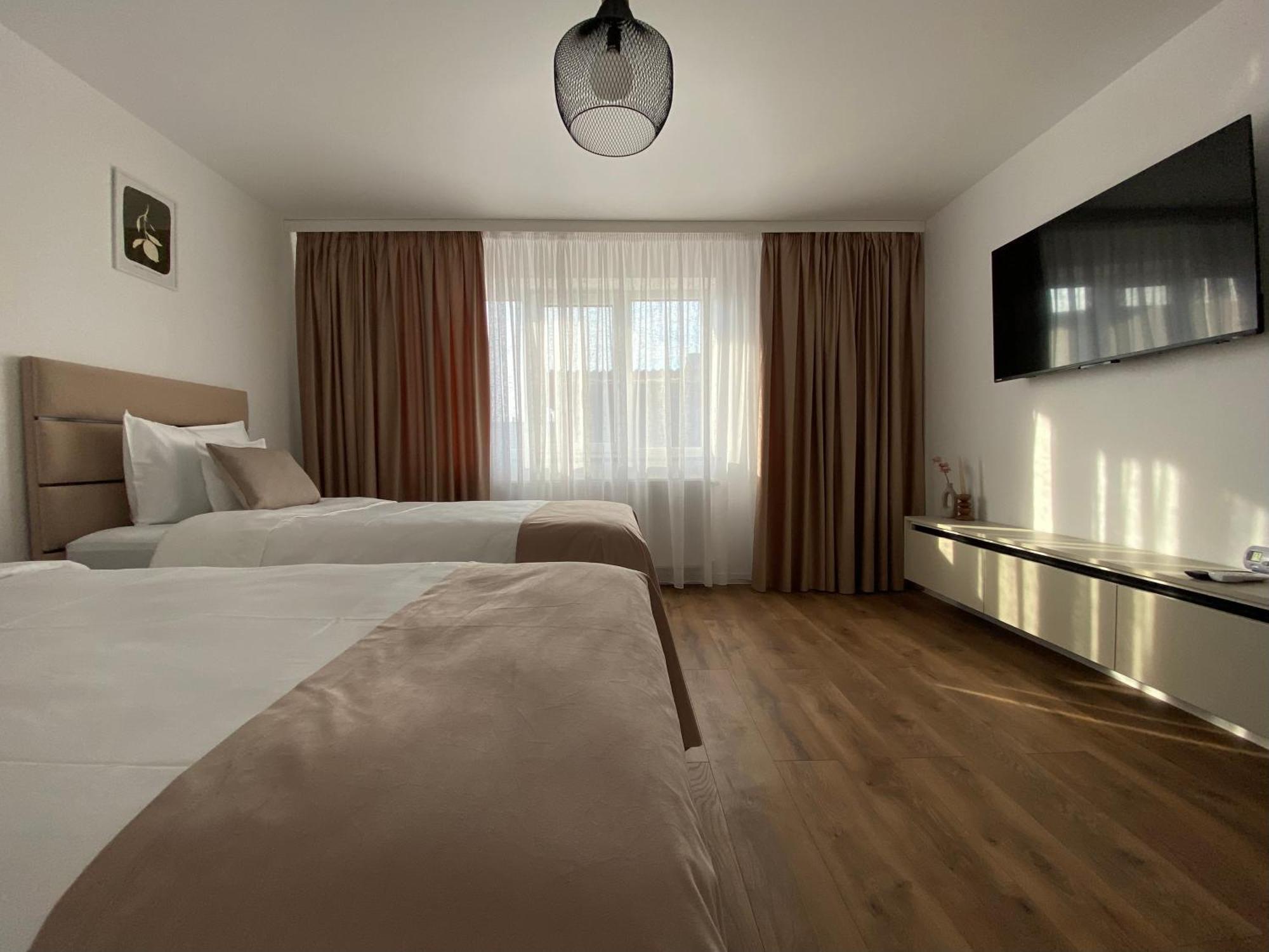 Cosy Apartments & Bistro Pufesti Esterno foto